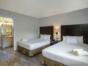 Twin beds in Remodeled Guest Room at Legacy Vacation Resorts