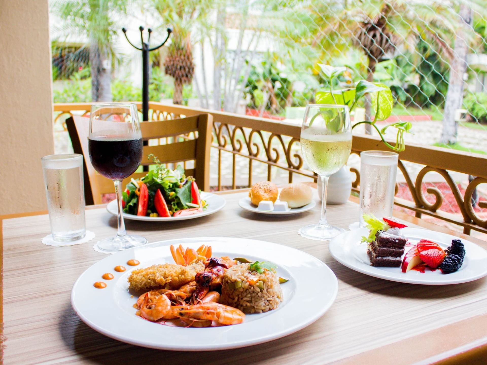 Meal served in Pergolas Restaurant with grilled prawn rice at Plaza Pelicanos Grand Beach Resort