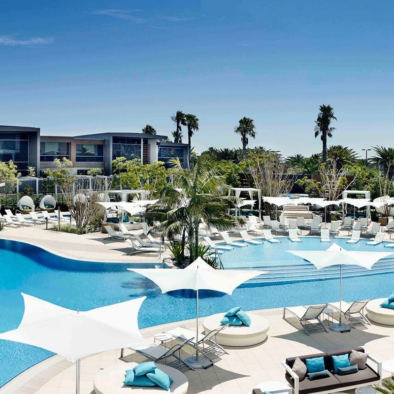 Pool area with sun loungers at Crown Metropol Perth