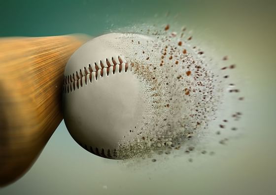 Close-up of a baseball hit by a wooden bat at Paramount Hotel Seattle