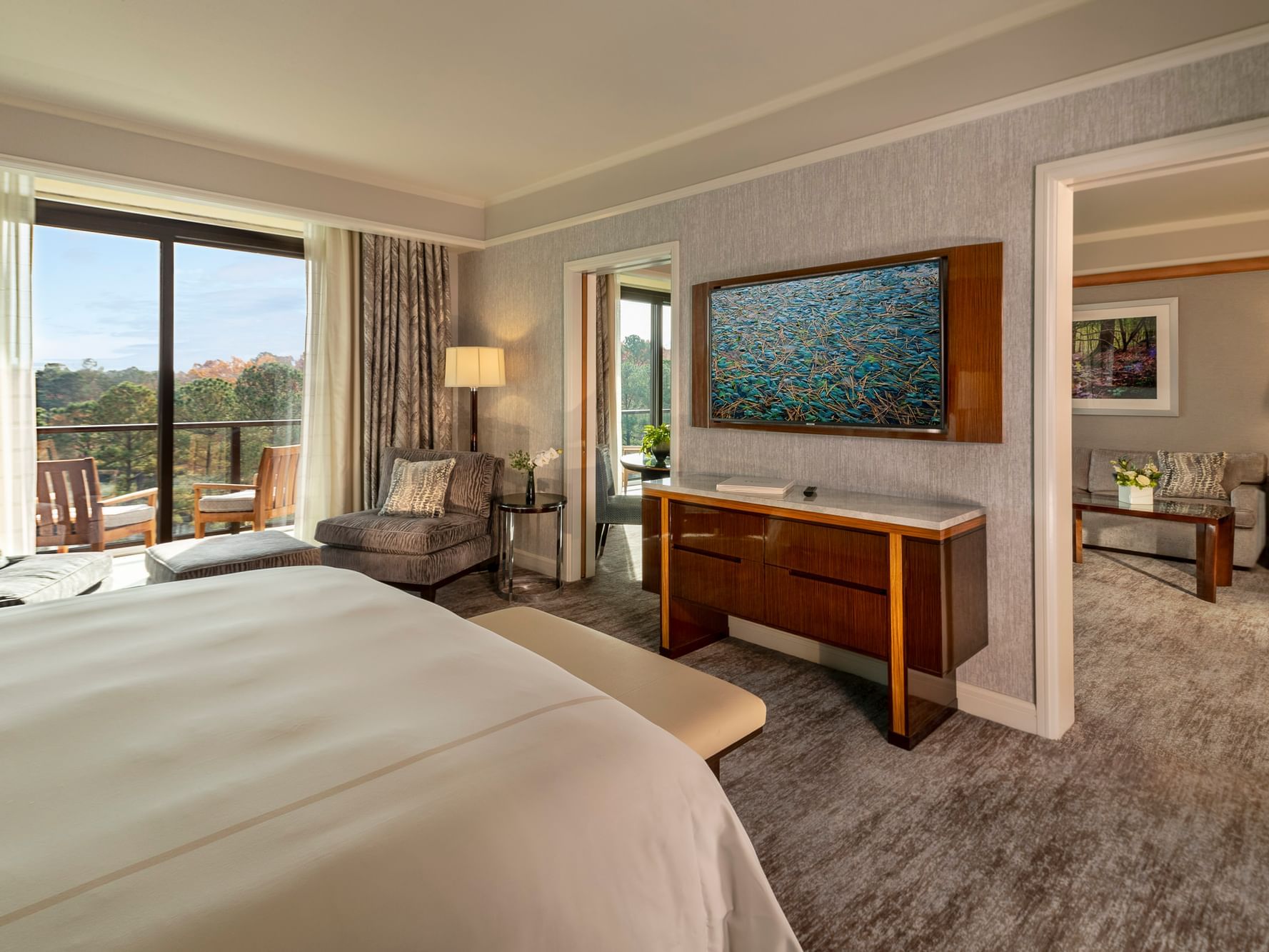 Interior of One Bedroom Lake View Balcony Suite with two balcony entrances at The Umstead Hotel and Spa