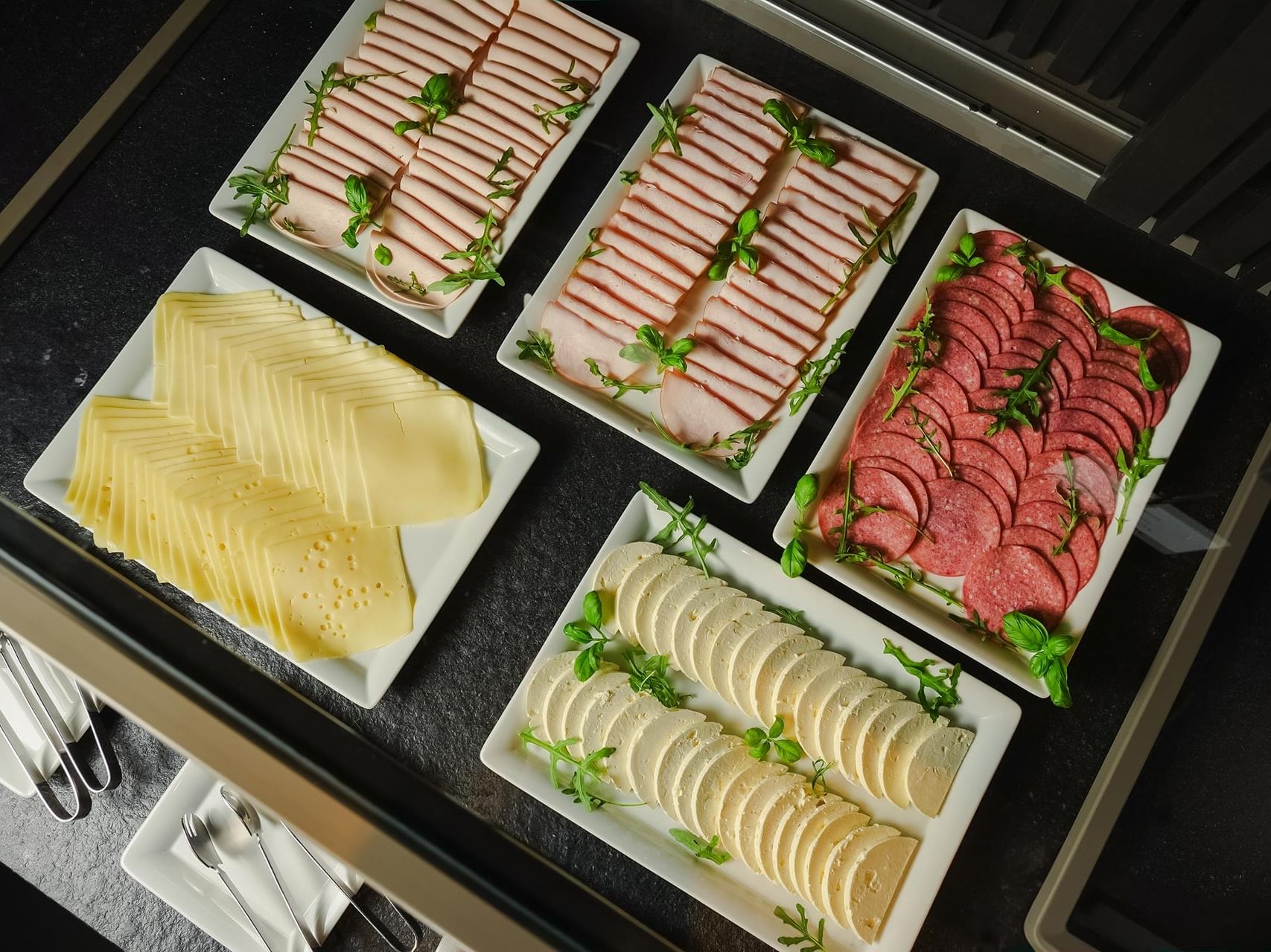 Plates of assorted deli meats and cheeses at Sylter Hof Berlin.