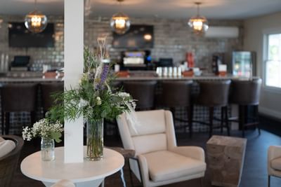 a vase of flowers in a restaurant