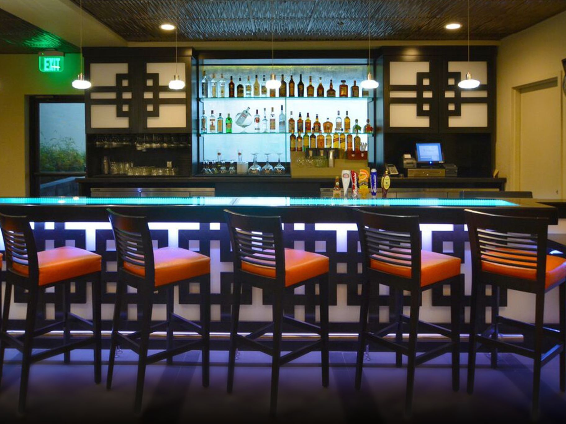 Stools by bar counter, International Pub, Rosen Inn Universal