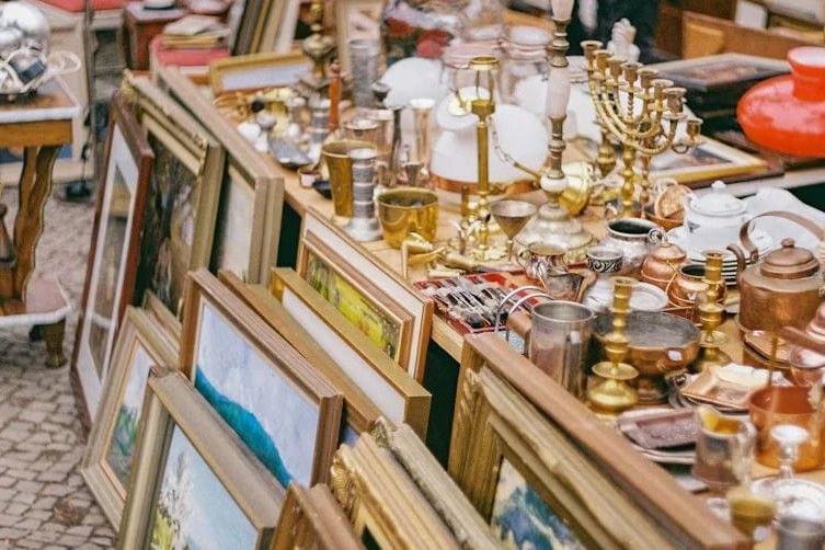 Flea market at Vienna Naschmarkt with paintings, antiques, candlesticks and vintage finds
