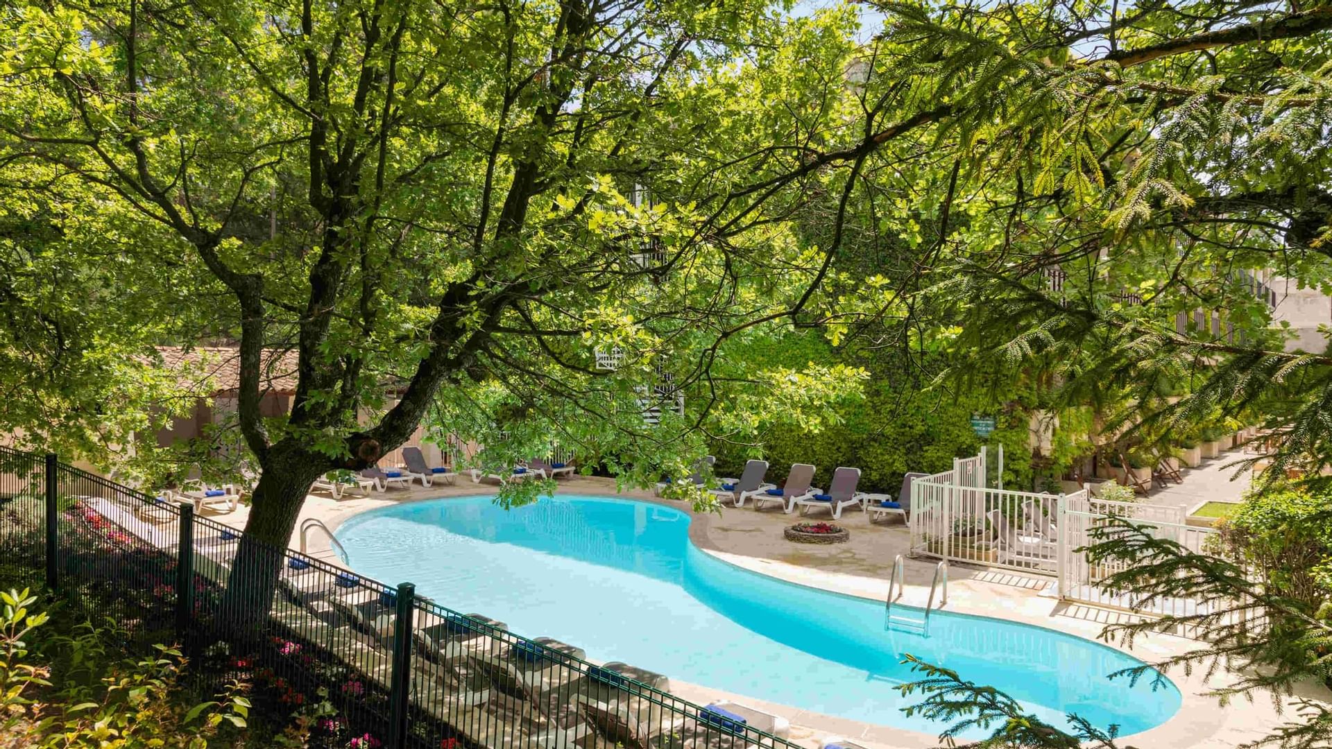 High angle shot of an outdoor pool at Originals Hotels