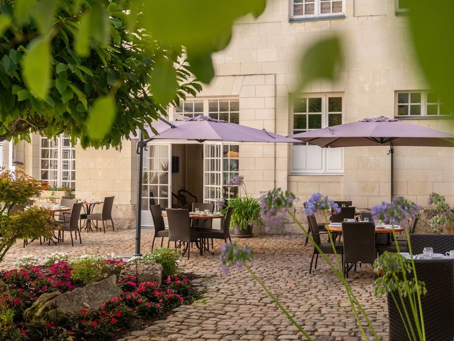 An outdoor dining area at Hotel Anne d'Anjou in Saumur France