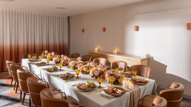 Elegant private dining room at Novotel Sydney Darling Harbour decorated for special celebration with seating for guests