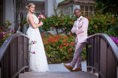 Wedding couple posing by the bridge at Bougainvillea Barbados