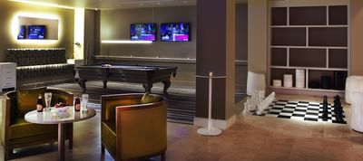 Lounge & billiards table area in a game room at Ocean Place