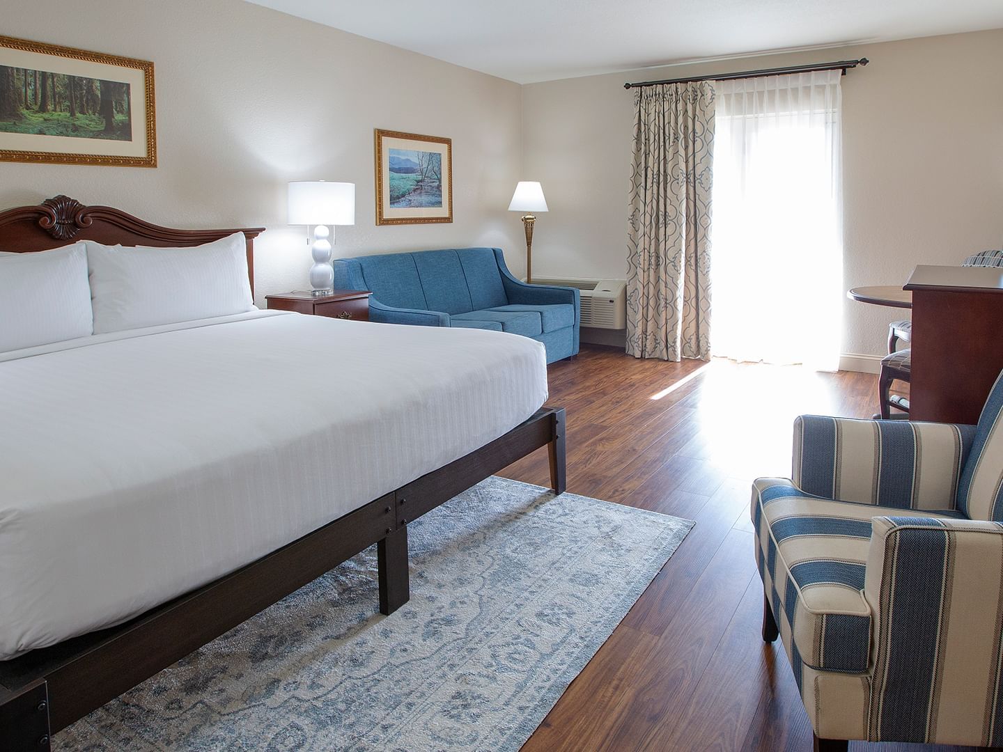 Bedroom arrangement in Deluxe King Room at Music Road Resort Inn