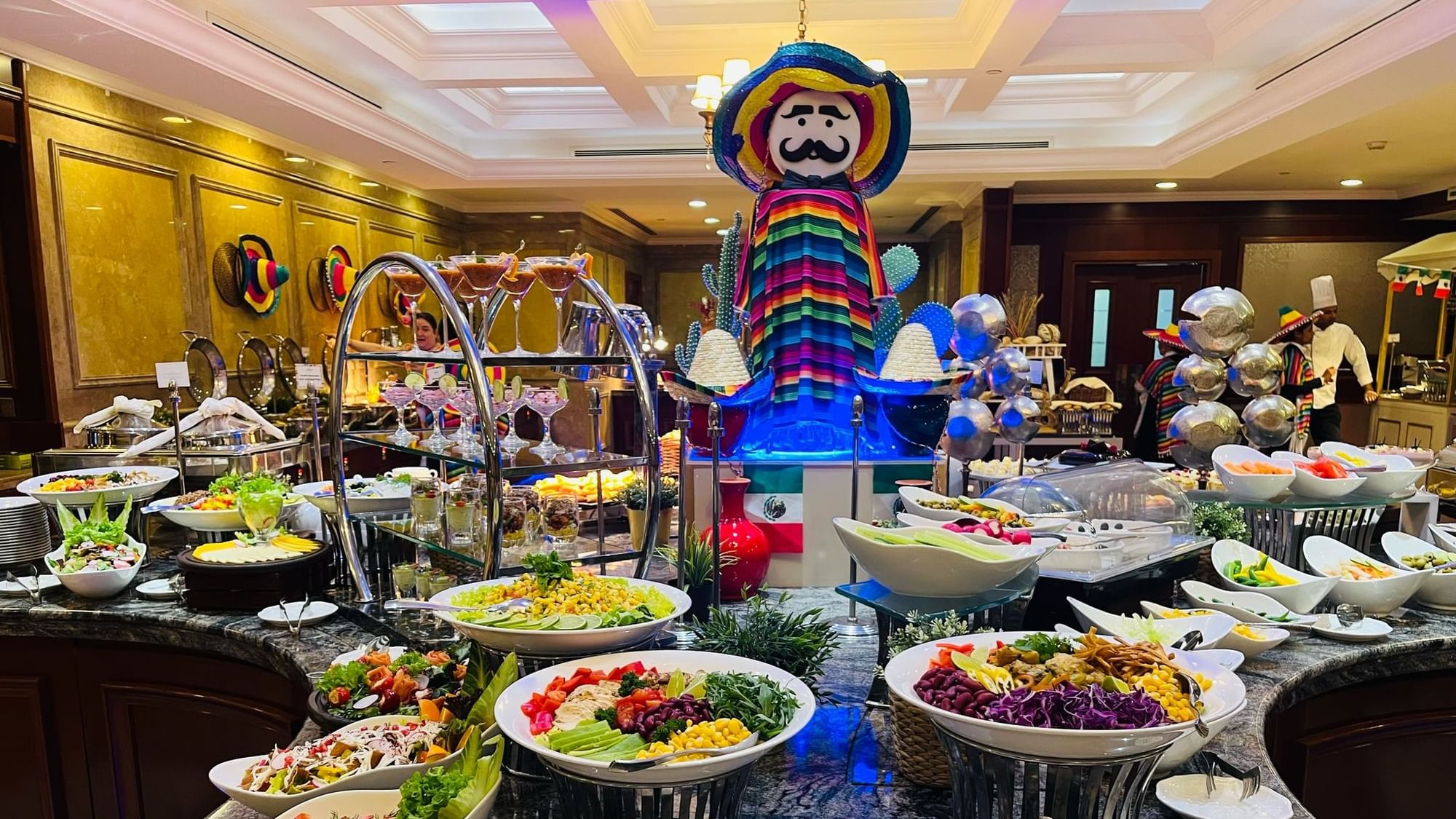Mexican Night buffet spread with diverse dishes and decorations at Warwick Doha in Doha.