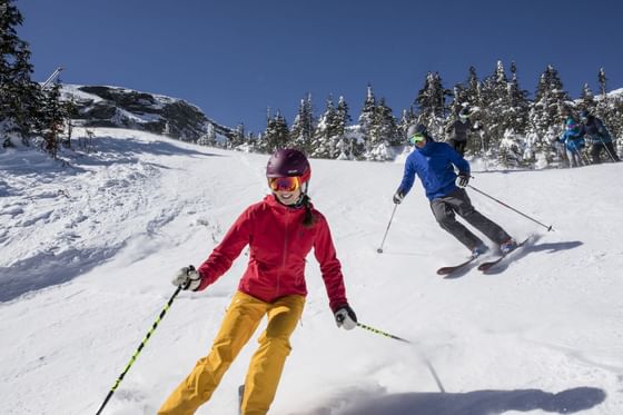 Friends cross-country skiing near Topnotch Stowe Resort