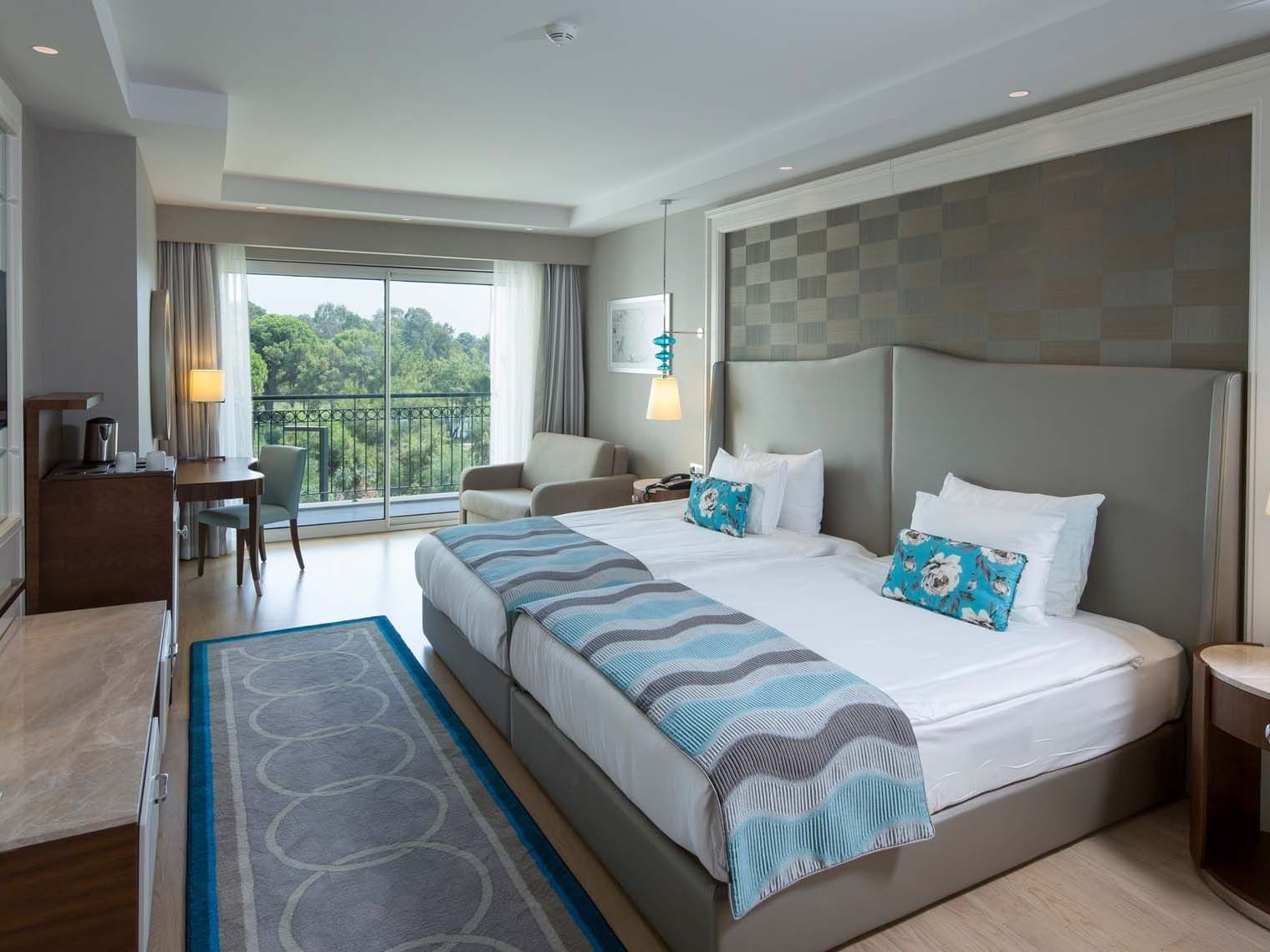 Sitting area & work desk by the bed in Standard Room at Titanic Deluxe Golf Belek