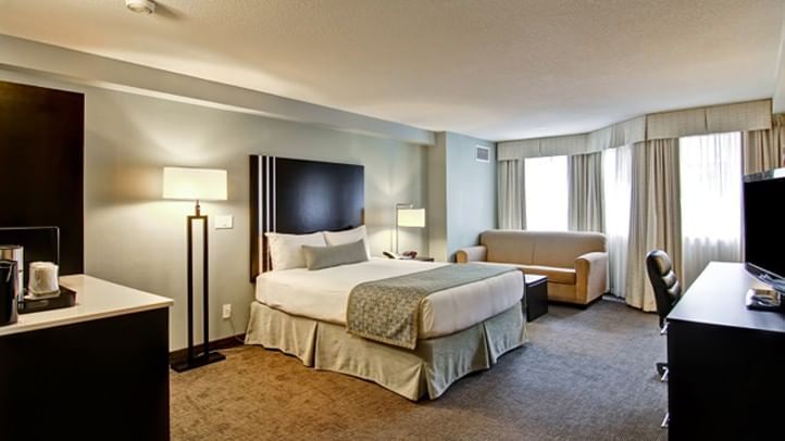 Bed and sofa in hotel room