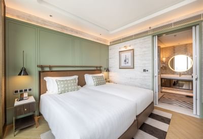 Double bed & bathroom vanity in Premium One-Bedroom Suite with Lounge Access at Eastin Grand Hotel Phayathai