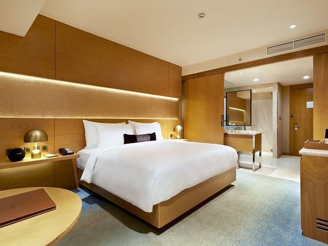 Bedroom with a king bed in Premium Room at Vasa Hotel Surabaya