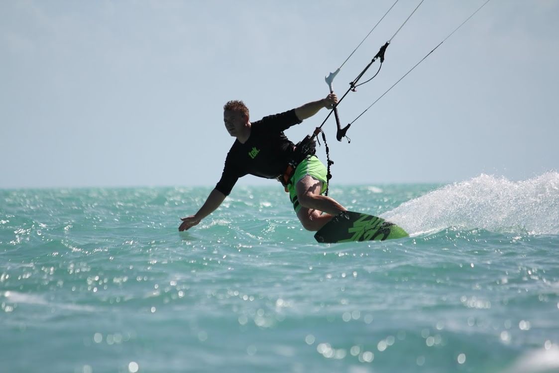 Man Kiteboarding at the beach near The Somerset on Grace Bay