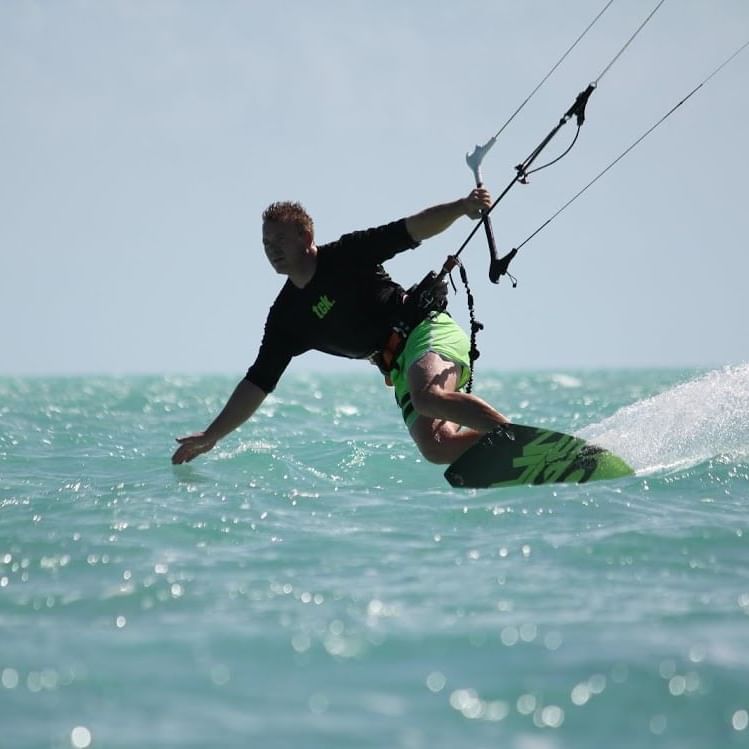Man Kite boarding at the beach near Somerset On Grace Bay 