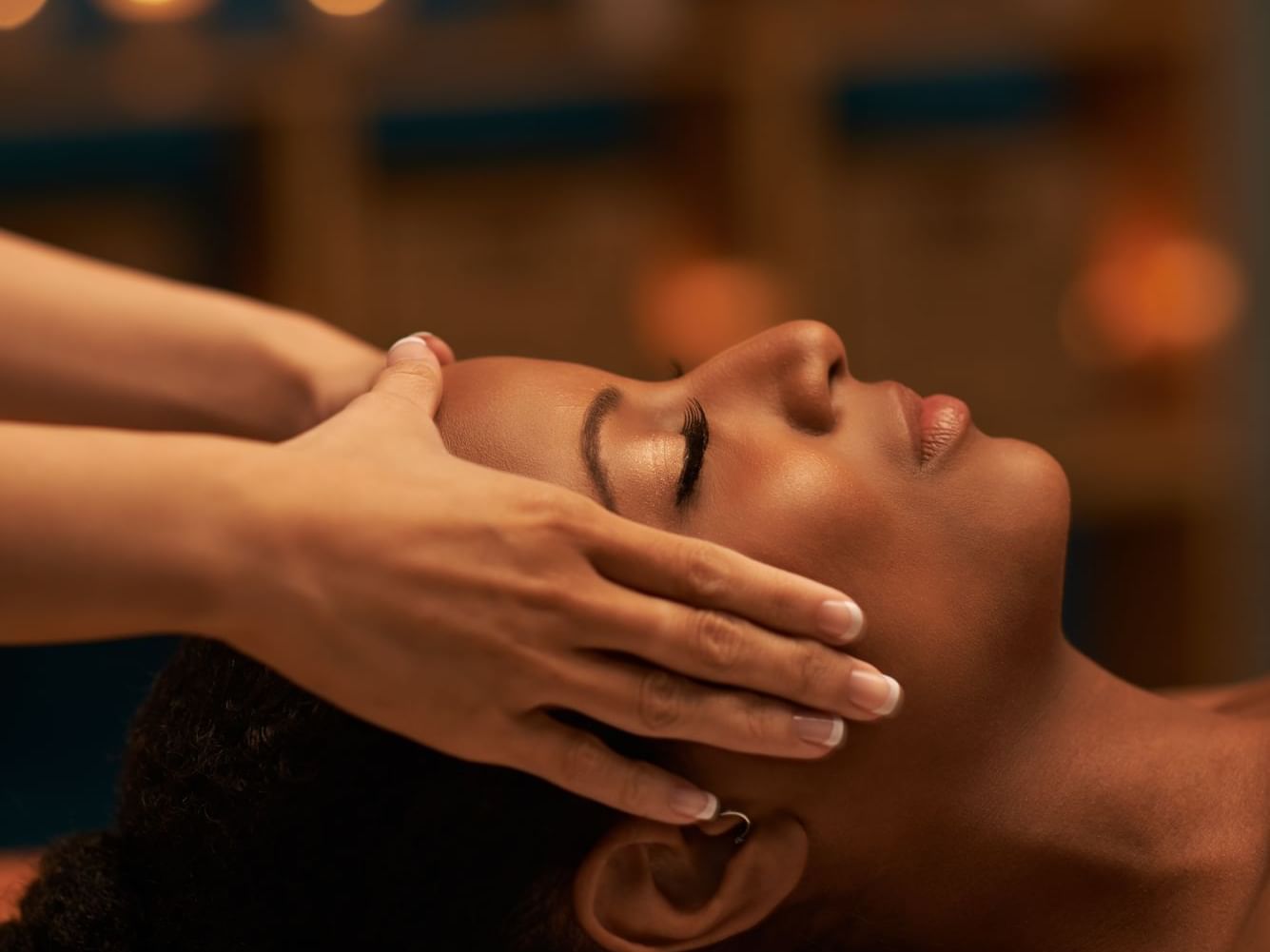 Lady getting a head massage in the Spa at Punta Islita Hotel