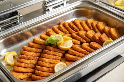 Close-up of Schnitzel platter in uhud at Elaf Al Taqwa Hotel