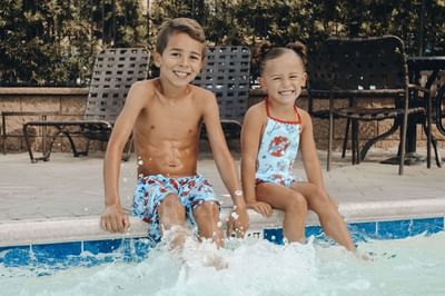 Kids at the pool of Hotel Grand Legacy at The Park Anaheim.