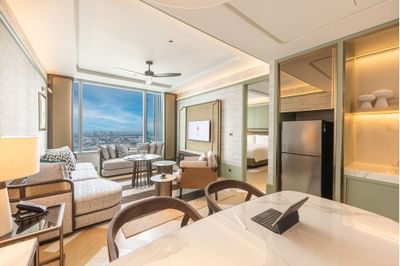 Dining area, refrigerator & sofa in Two-Bedroom Suite with Lounge Access at Eastin Grand Hotel Phayathai