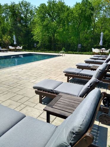 Sunbeds by the outdoor pool area near The Inn at Willow Grove