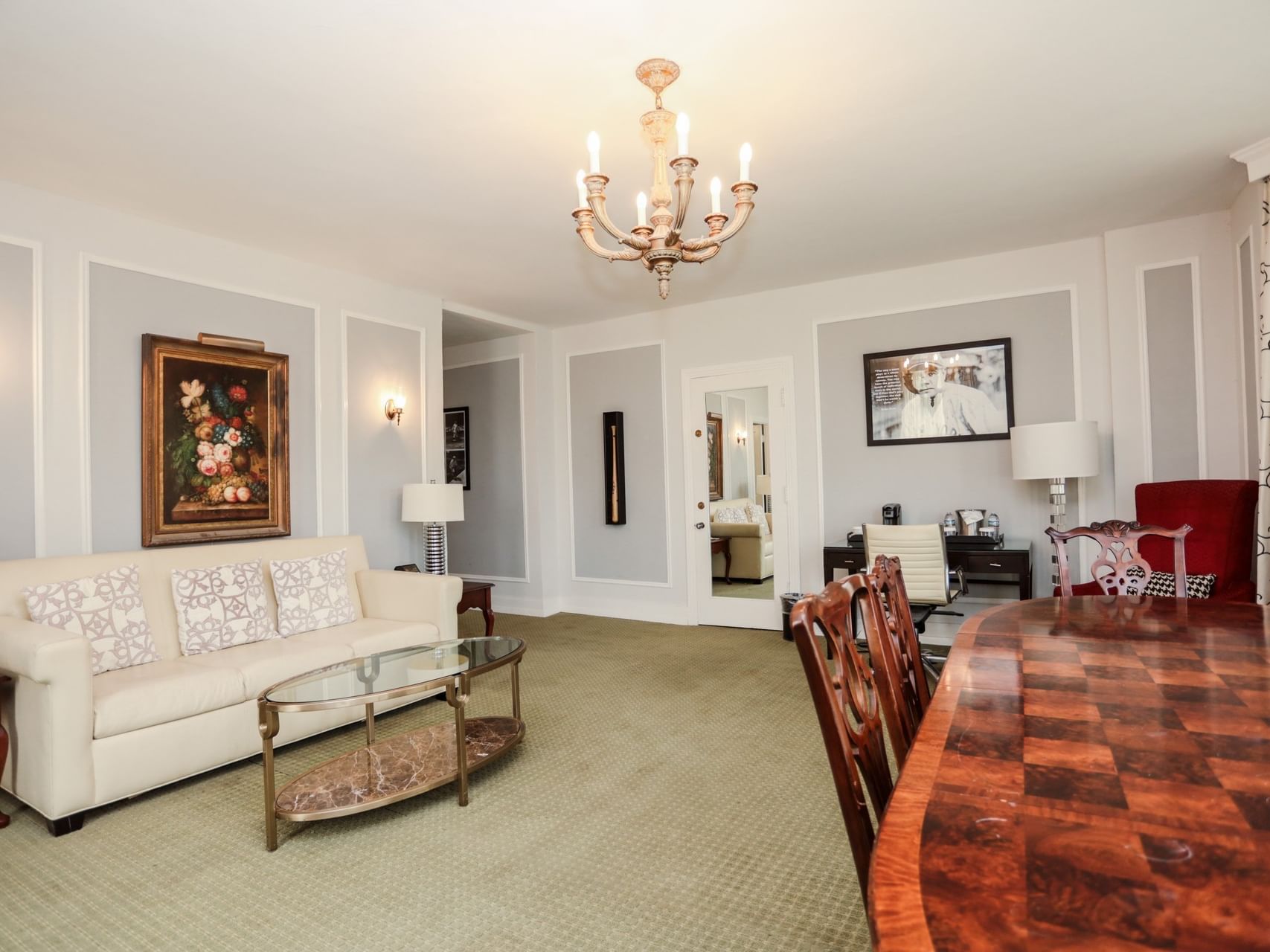 The Babe Ruth Bright living space with a wooden dining table and floral wall art at Arlington Resort Hotel & Spa