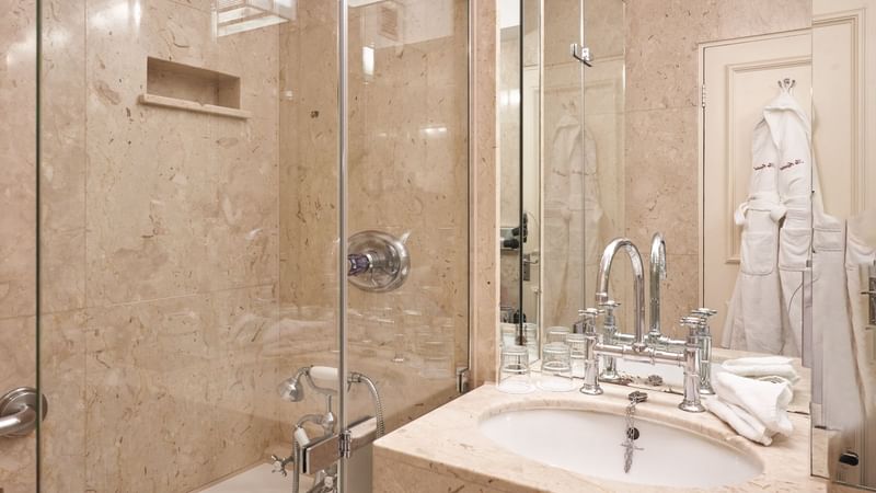 Bathroom interior with a marbled vanity in Classic Room at The Capital Hotel London