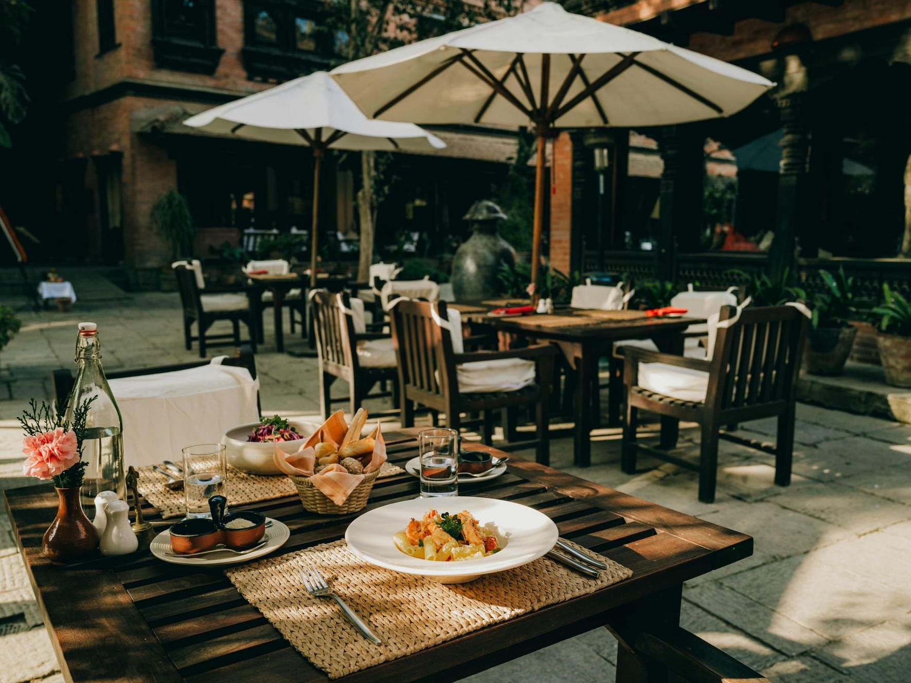 Dishes served on the outdoor dining area in The Dwarika's Courtyard at Dwarika's Hotel Kathmandu