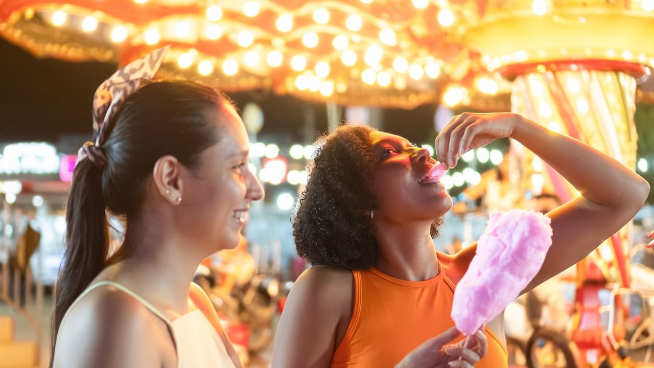two people eating cotton candy