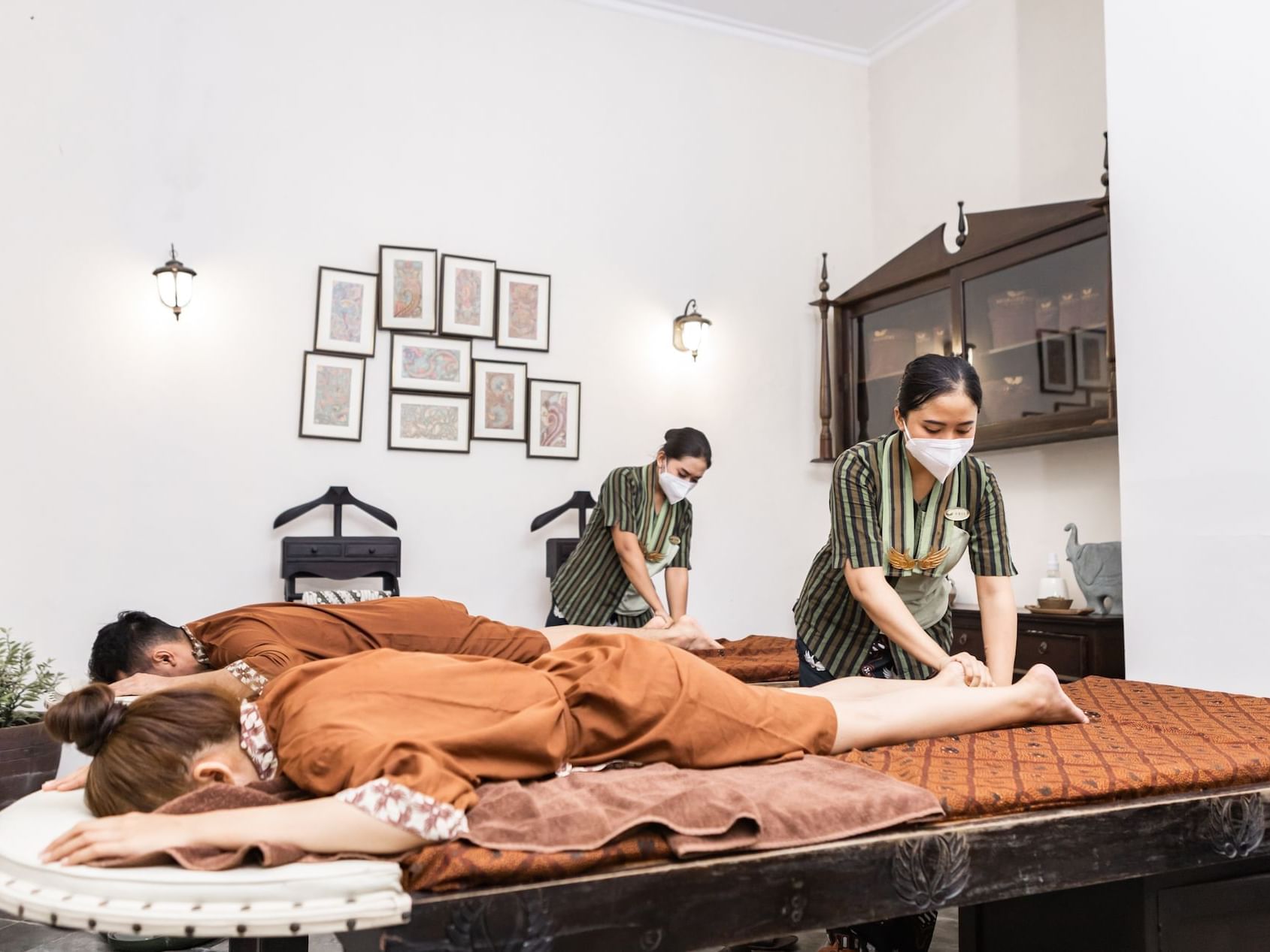 A couple receiving a massage at the Spa in Royal Ambarrukmo Yogyyakarta