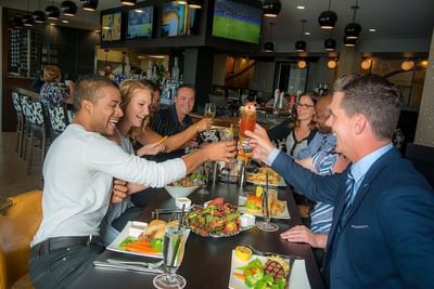 People enjoying in Tonic Kitchen + Bar, Hotel Clique Calgary