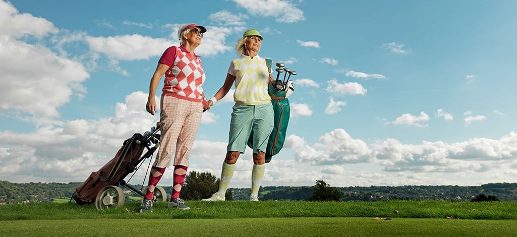 two ladies playing golf