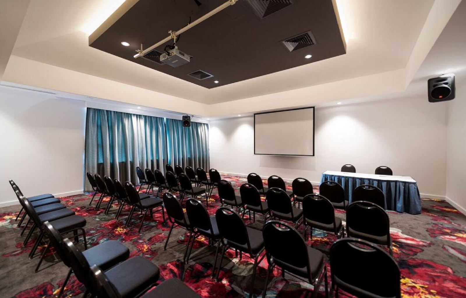 Table setup in Meeting hall with projector at Novotel Barossa