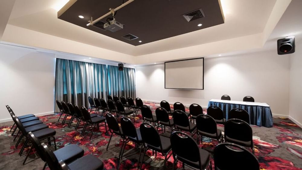 Table setup in Meeting hall with projector at Novotel Barossa
