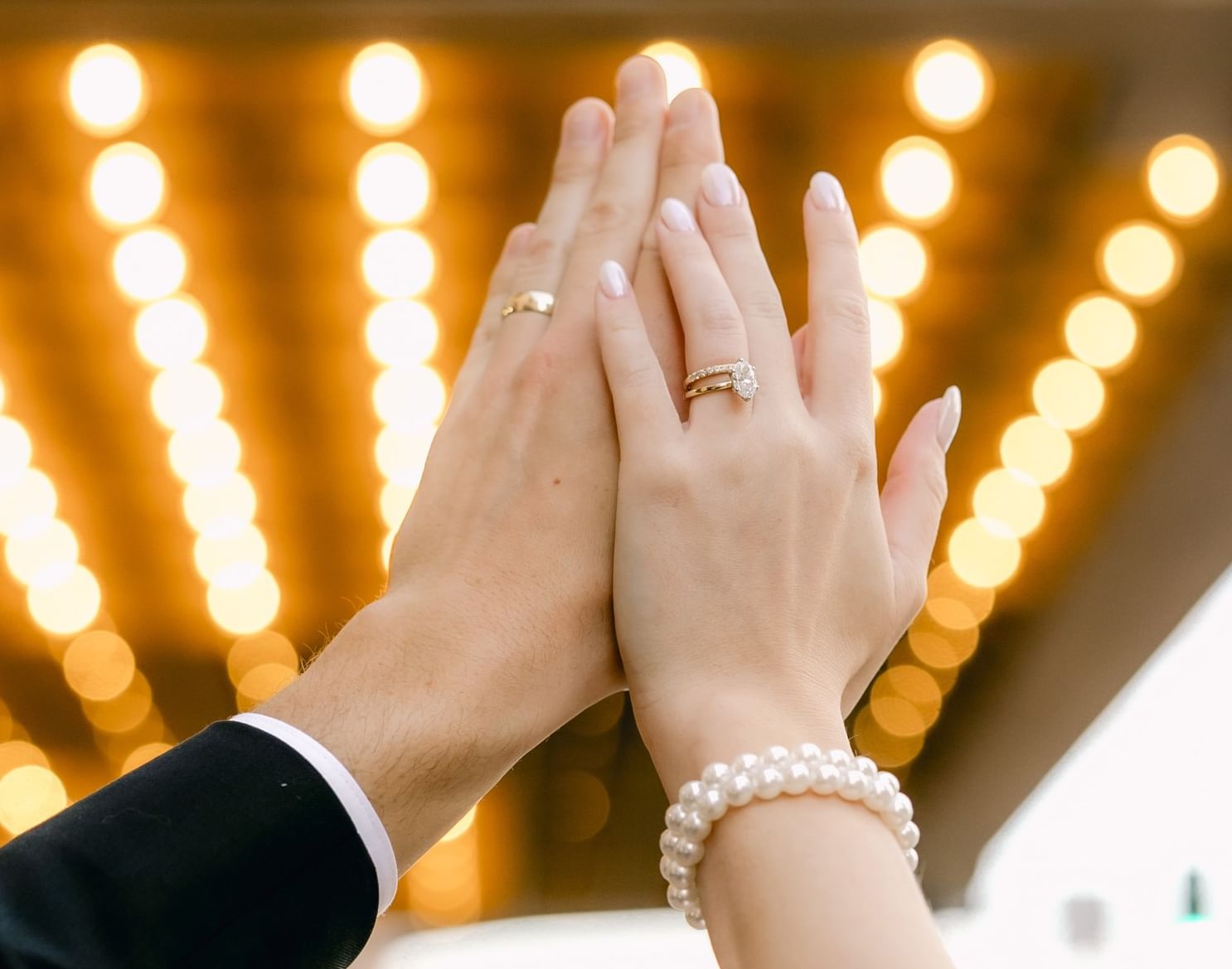 Newly married couple hugging on a terrace at The Grove Hotel
