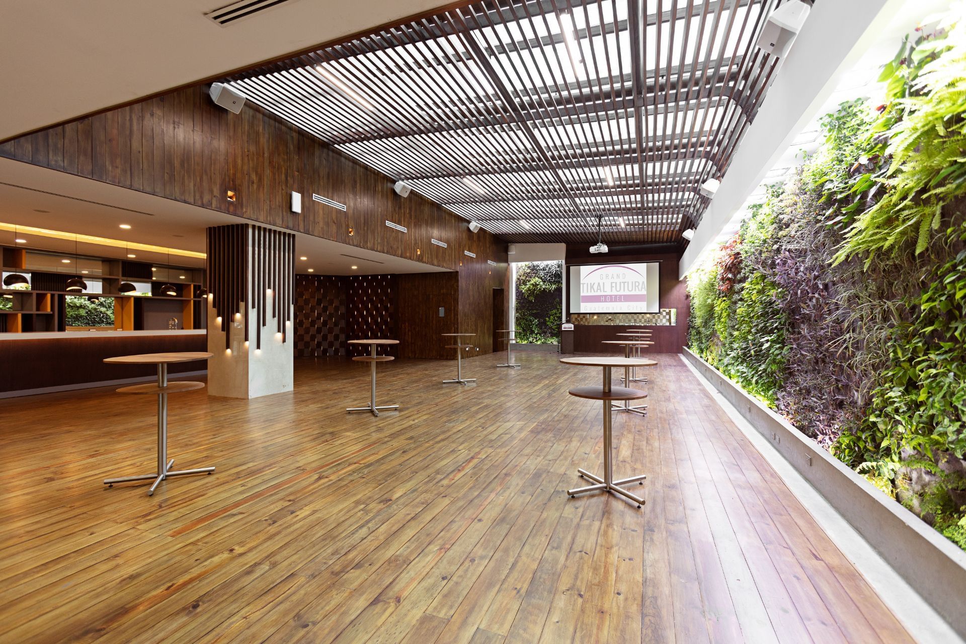 High tables & eco wall in the foyer at Tikal Futura Hotel