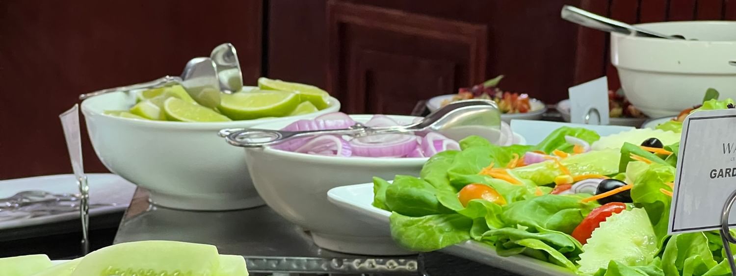 Variety of fresh salads and dishes displayed on a buffet table at Lagoon Terrace Restaurant in Efate at Warwick Le Lagon Vanuatu