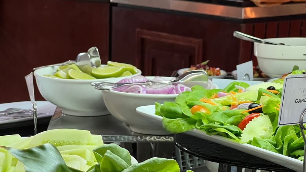 Variety of fresh salads and dishes displayed on a buffet table at Lagoon Terrace Restaurant in Efate at Warwick Le Lagon Vanuatu.
