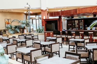 Large atrium bar and lounge with plenty of comfortable seating at Hotel Topeka. 