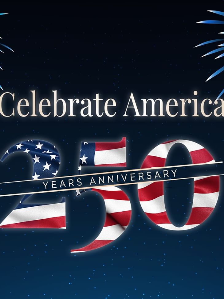 Fireworks display with American flag-patterned 250 years anniversary logo celebrating America's milestone.
