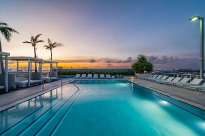 rooftop pool at sunset