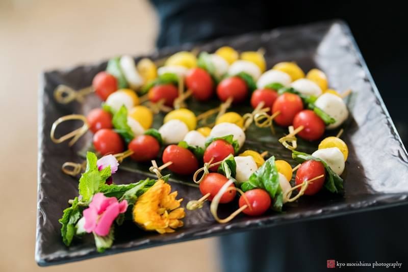 Caprese skewers with cherry tomatoes, mozzarella, and basil arranged on a slate platter at Aramark Chauncey Conference Center