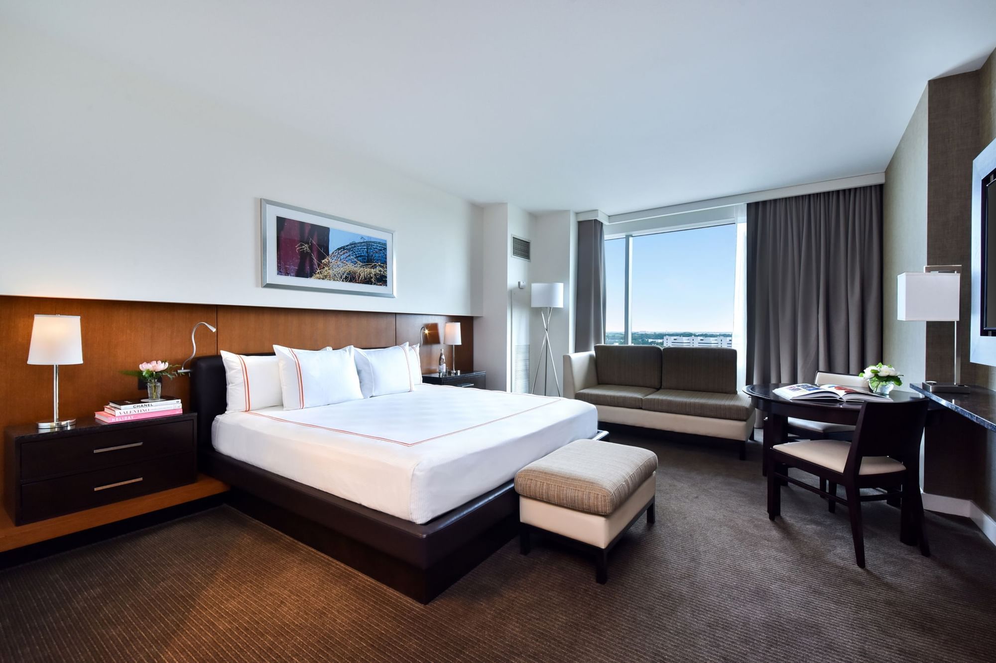Hotel bedroom with king bed and seating area
