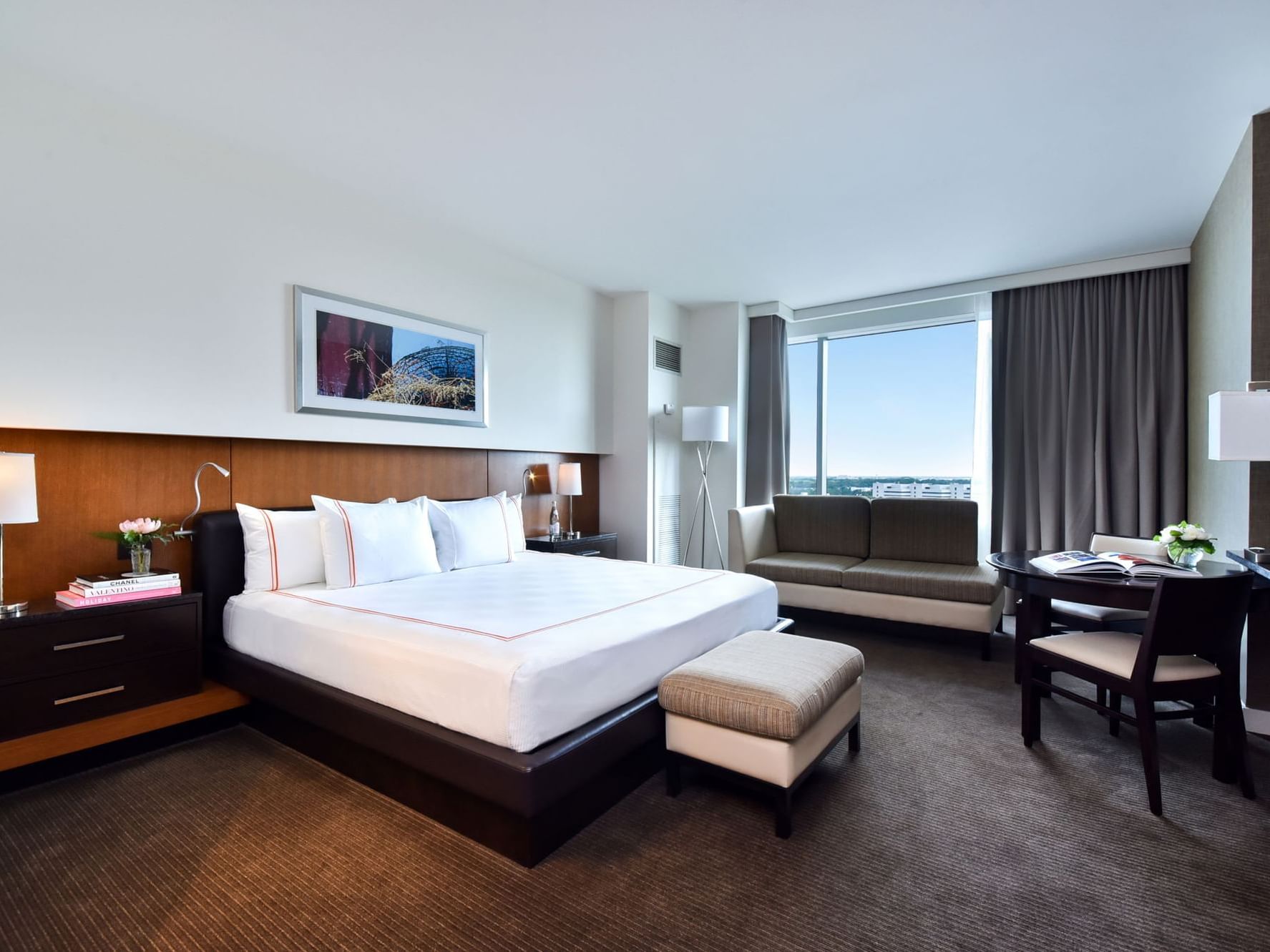 a bed and chair in a hotel room