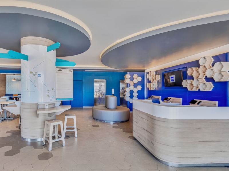 Lobby lounge area & front desk at One Hotels