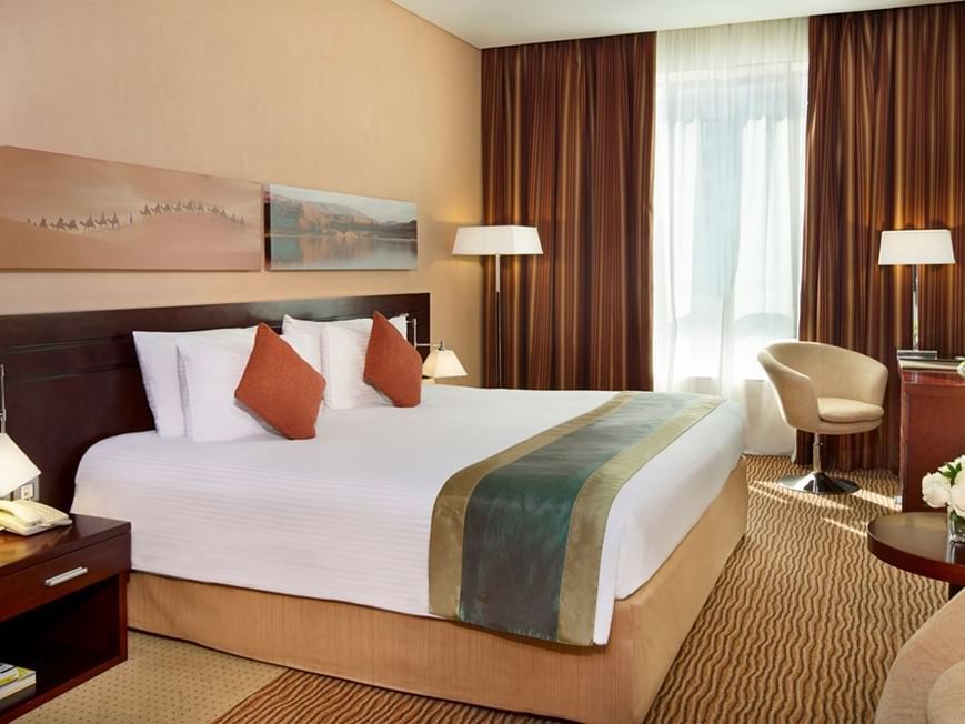 King size bed in Superior Room at City Seasons Hotels