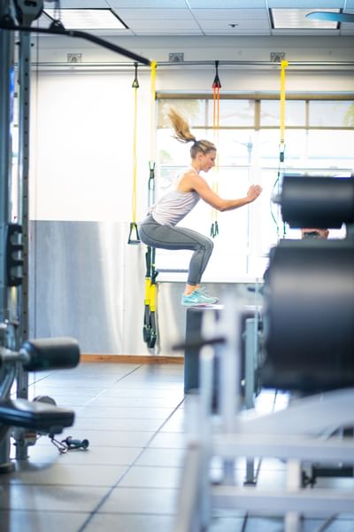 Woman exercising in fitness center